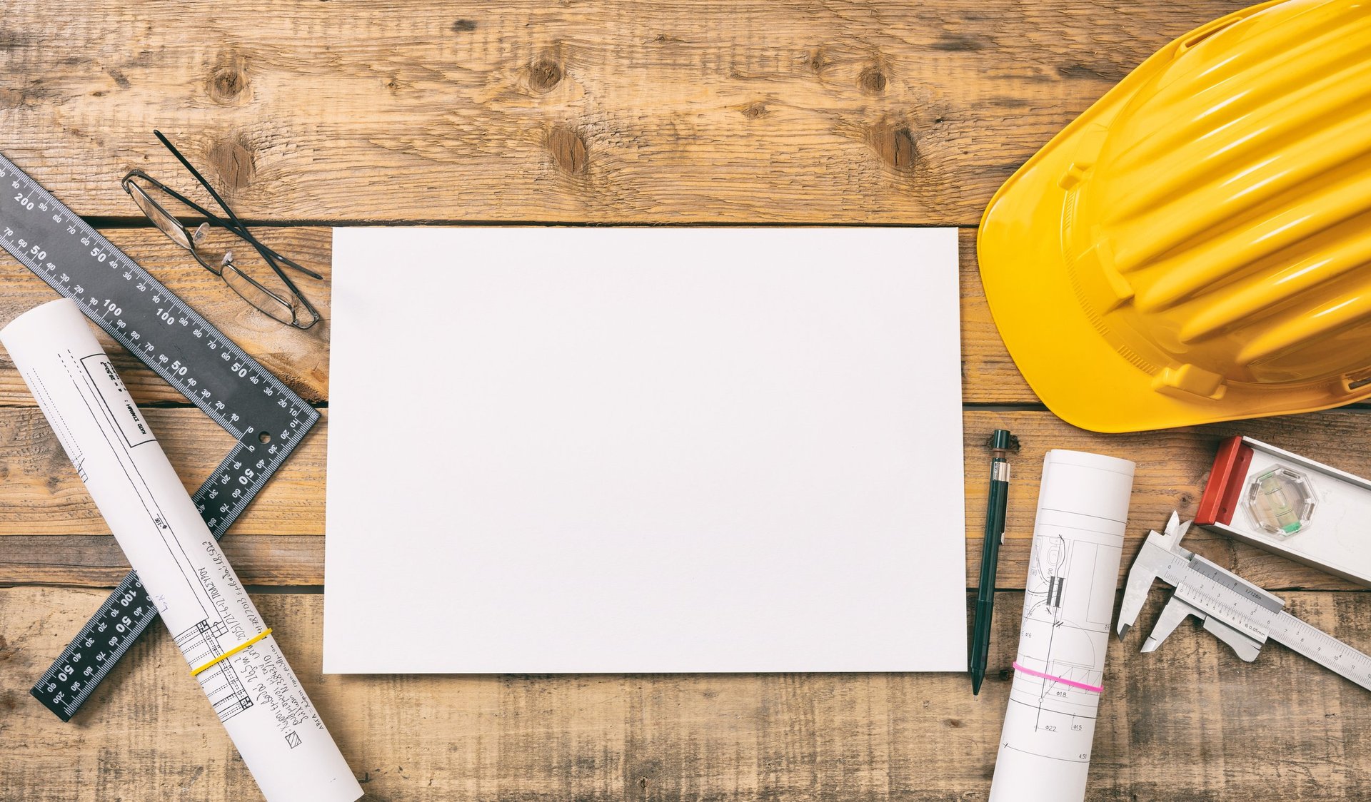 Architect workplace with blueprints and tools