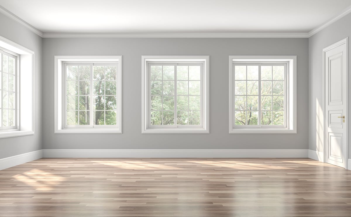 Classical empty room interior 3d render, The rooms have wooden floors and gray walls, decorate with white moulding, there are white window looking out to the nature view