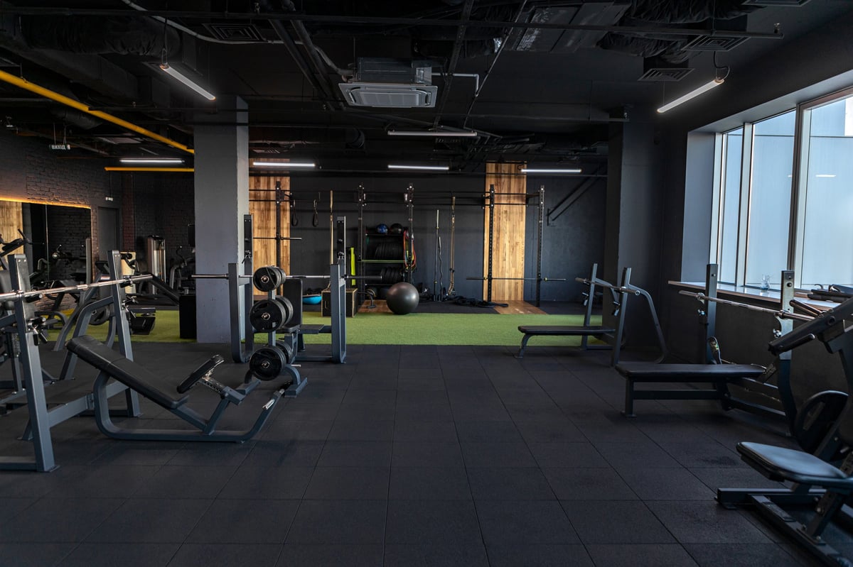 Dark gym interior with sports equipment